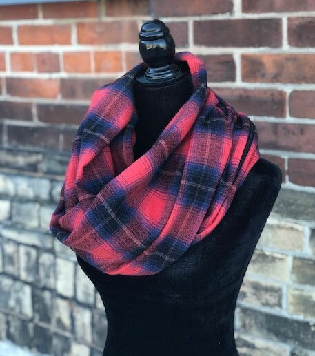 Hidden pocket infinity scarf with a blue and red plaid pattern