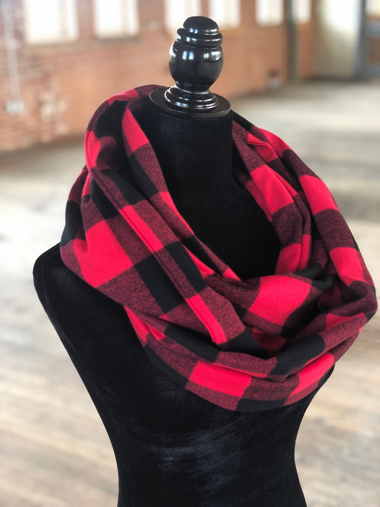 Hidden pocket infinity scarf with a black and red mammoth plaid pattern
