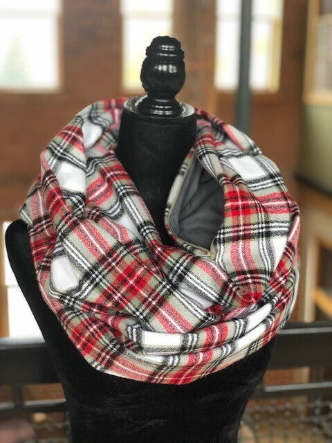 Hidden pocket infinity scarf with a green and red plaid pattern