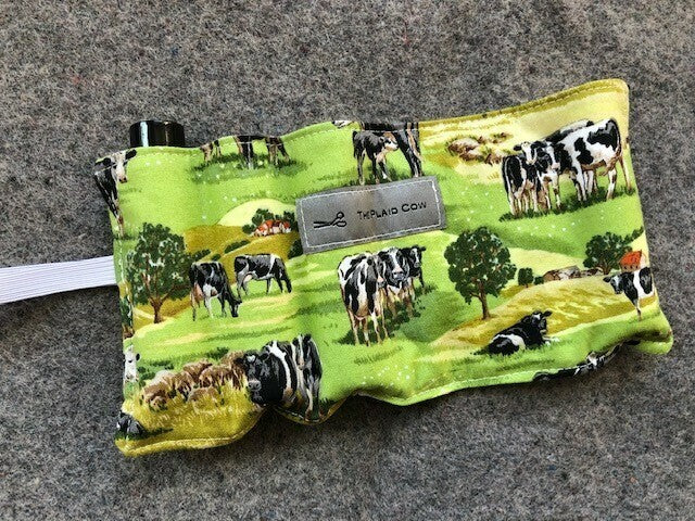 Cows in a green pasture roller ball wrap