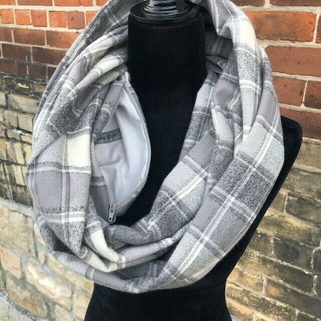 Hidden pocket infinity scarf with light and dark grey plaid pattern