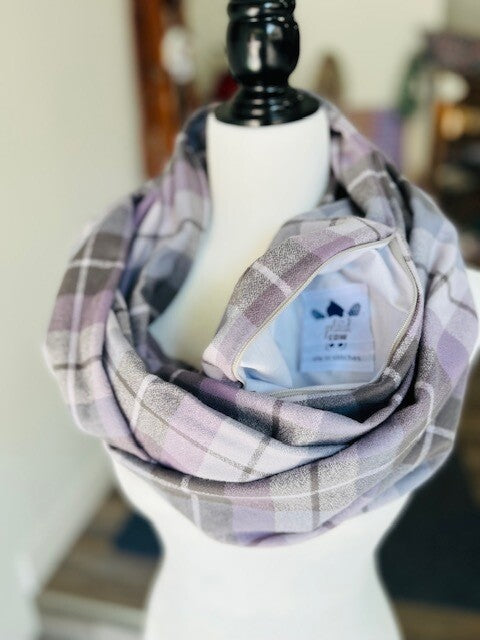 Hidden pocket infinity scarf with a cream, lavender and grey plaid pattern