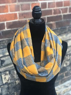 Hidden pocket infinity scarf with a mustard yellow and grey mammoth plaid pattern