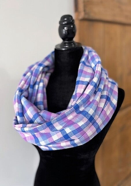 Hidden pocket infinity scarf with a blue and pink plaid pattern