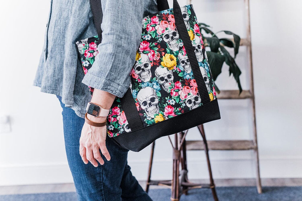 Skulls with red and yellow florals tote bag