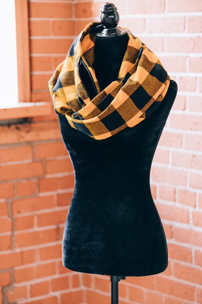 Hidden pocket infinity scarf with a yellow and black mammoth plaid pattern