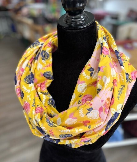 Hidden pocket infinity scarf with pink florals on a yellow background